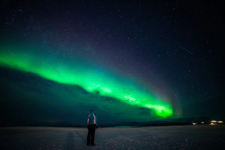 Girl watching the Northern Lights. Abisko Sweden